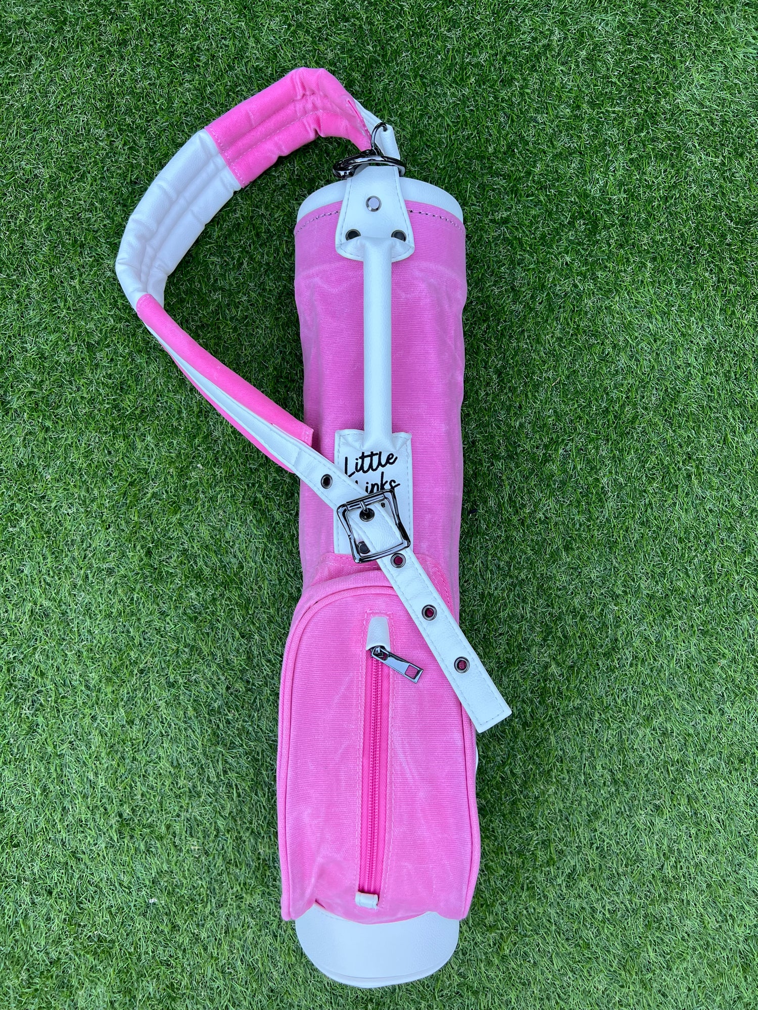 Pink coloured canvas toddler golf bag.