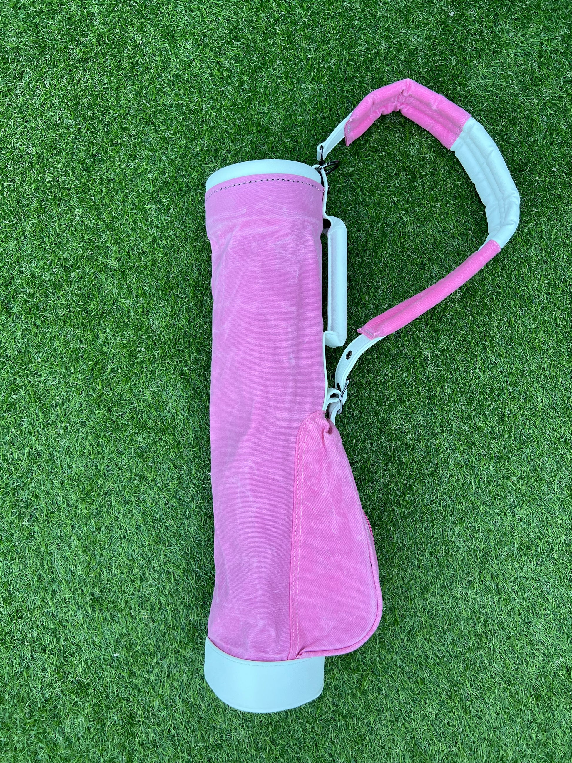 Pink coloured canvas toddler golf bag.