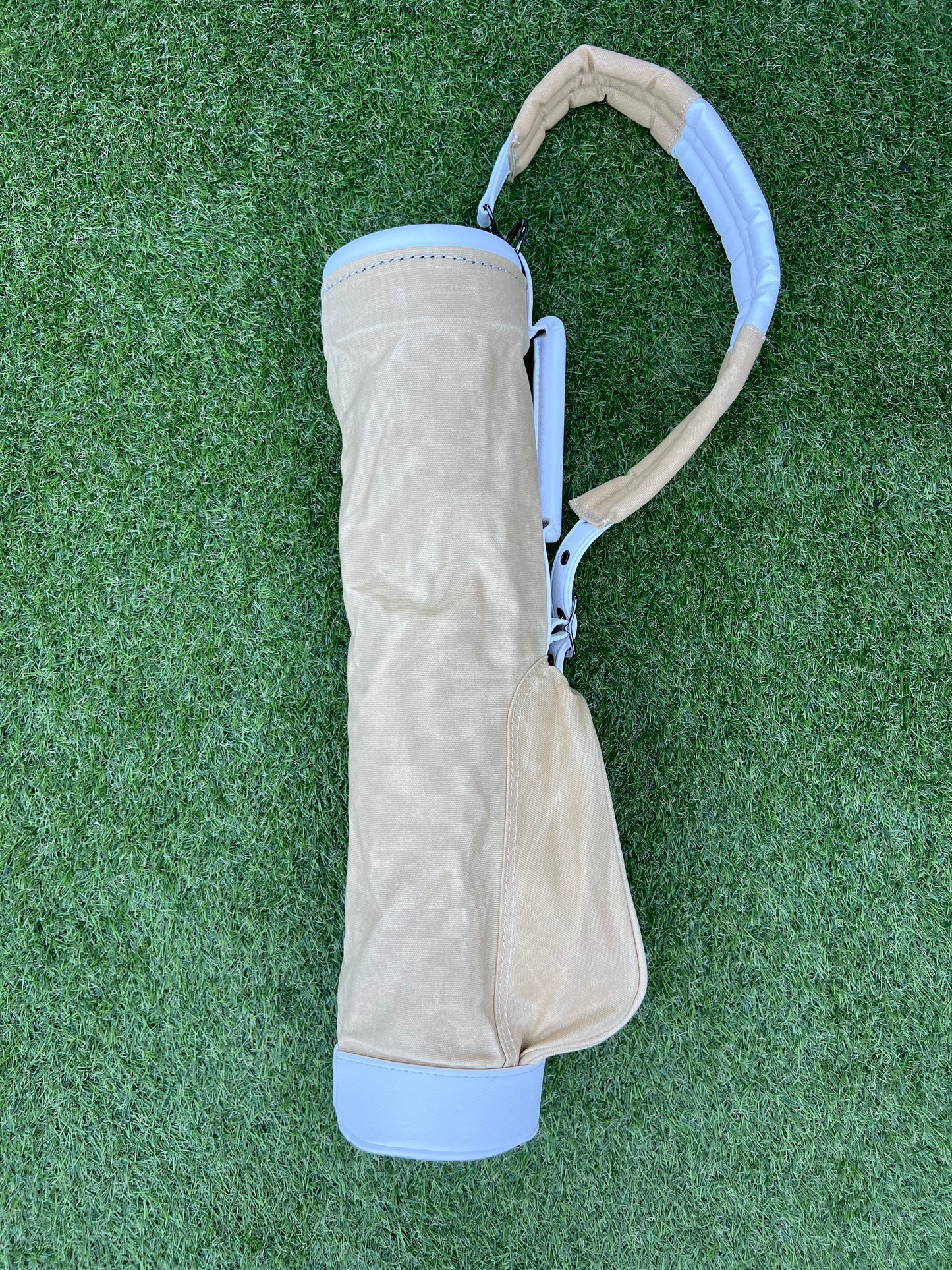 Sand coloured canvas toddler golf bag.