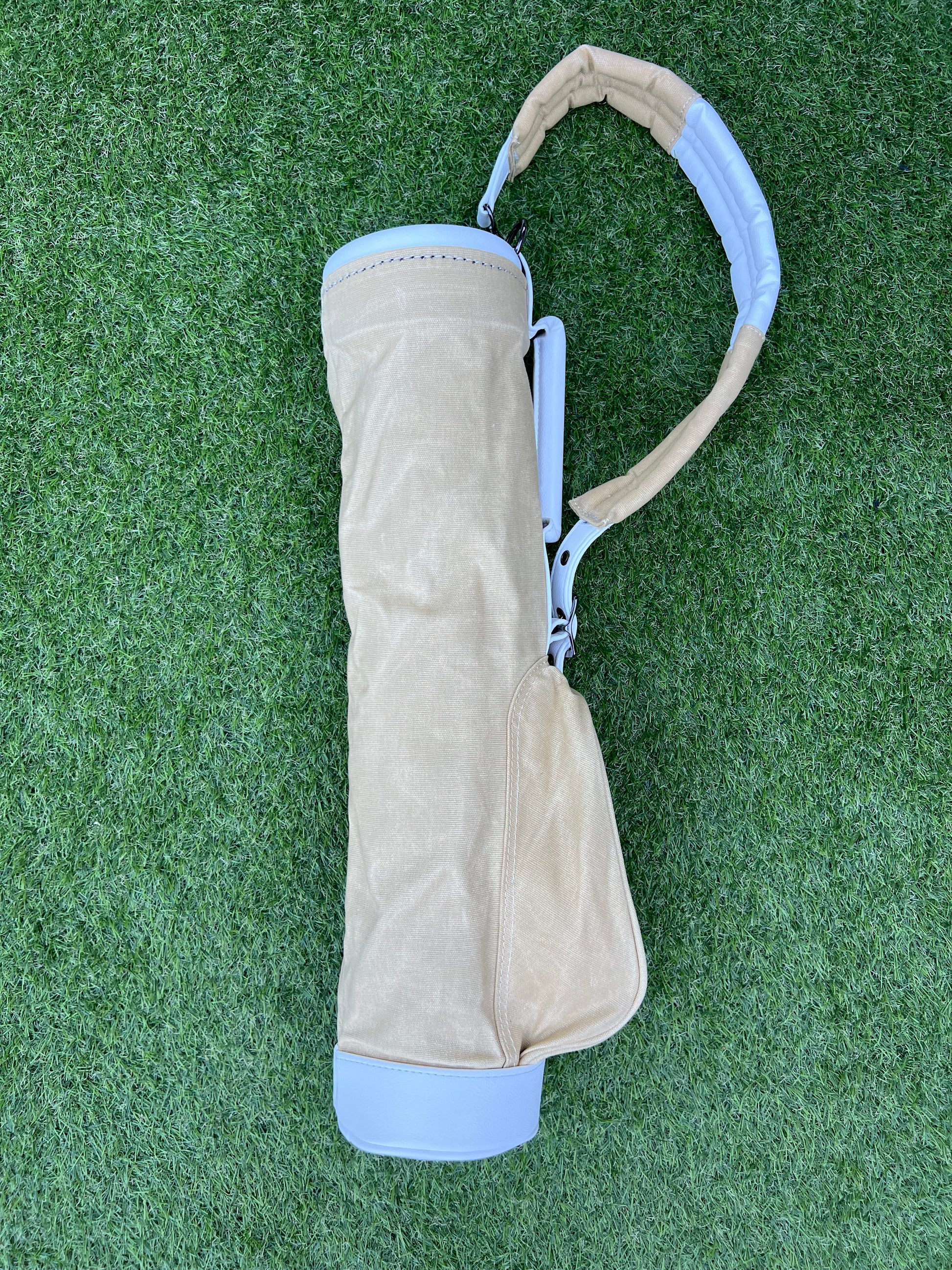 Sand coloured canvas toddler golf bag.